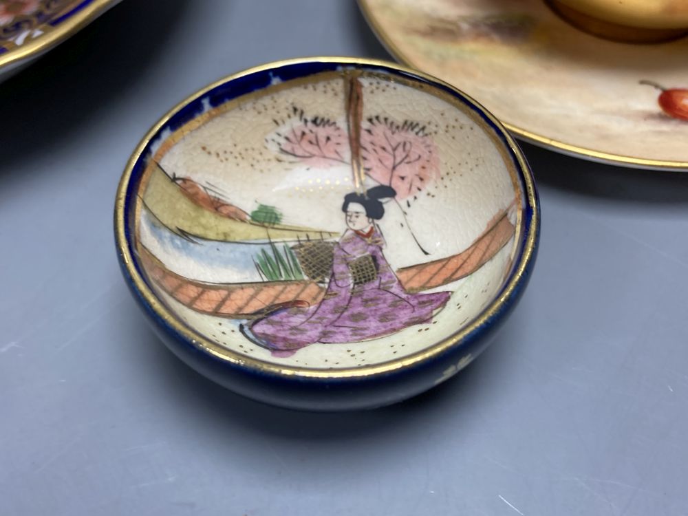 A Royal Worcester miniature cup and saucer painted with fruit, signed W. Hale, height 4cm, two scent bottles and sundries